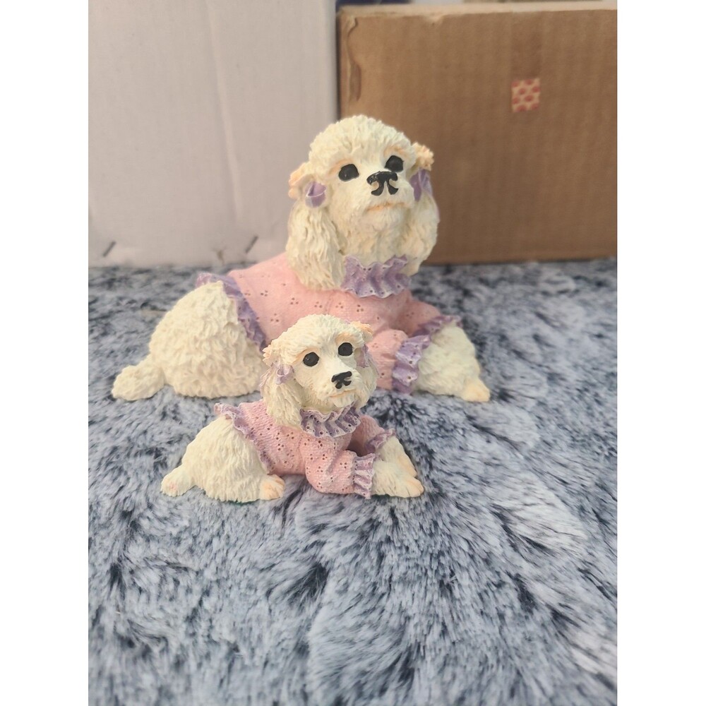 vintage figurine set featuring a mother white poodle and her puppy wearing match